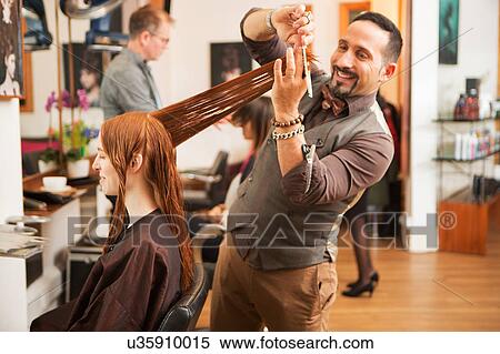 Female customer having long red hair trimmed in hair salon View Large Photo Image Stock Photography - Female customer having long red hair trimmed in hair salon. Fotosearch