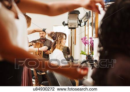 Female customers having their hair styled in hair salon View Large Photo Image Stock Image - Female customers having their hair styled in hair salon. Fotosearch