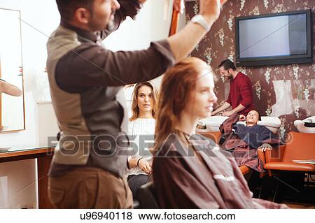Female customers having their hair styled in hair salon View Large Photo Image Stock Photo - Female customers having their hair styled in hair salon. Fotosearch