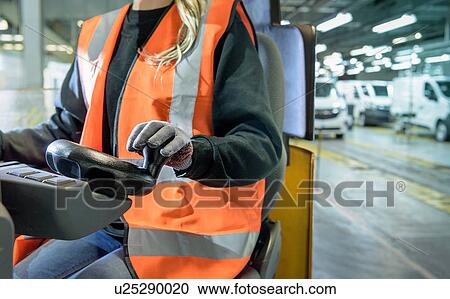 Female forklift driver in car factory, close up View Large Photo Image Stock Image - Female forklift driver in car factory, close up. Fotosearch