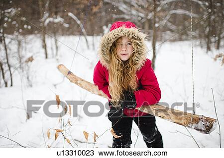 Girl leaning on wooden swing in woods View Large Photo Image Stock Image - Girl leaning on wooden swing in woods. Fotosearch