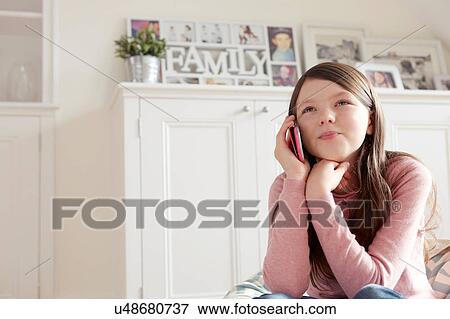 Girl making smartphone call View Large Photo Image Stock Photo - Girl making smartphone call. Fotosearch