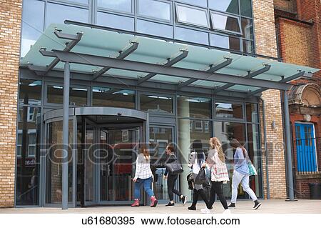 Stock Photography - Group of students entering building, rear view. Fotosearch