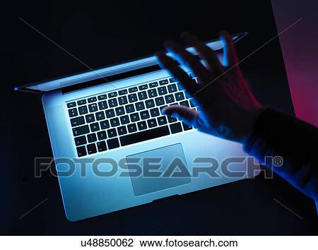 Hacking, man opening laptop computer View Large Photo Image Stock Image - Hacking, man opening laptop computer. Fotosearch