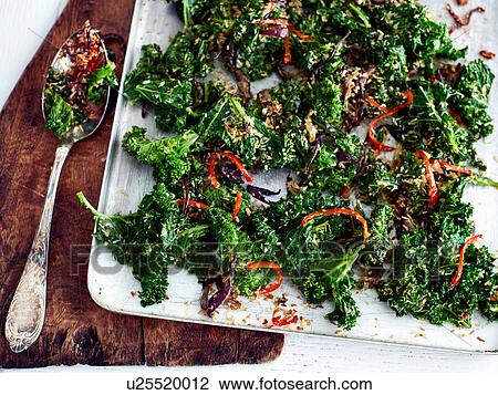 Stock Image - Kale, chilli and coconut side dish. Fotosearch
