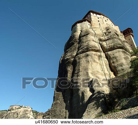 Stock Image - Low angle view of Roussanou Monastery on top of rock formation, Meteora, Thassaly, Greece. Fotosearch