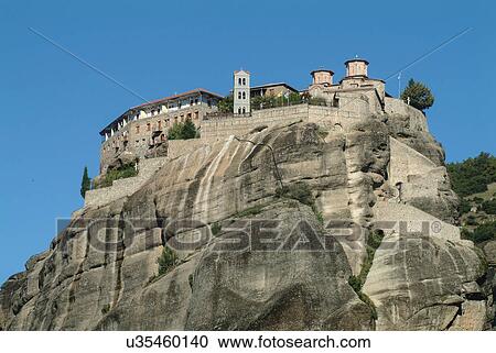Low angle view of Varlaam Monastery on rock formation, Meteora, Thassaly, Greece View Large Photo Image Stock Image - Low angle view of Varlaam Monastery on rock formation, Meteora, Thassaly, Greece. Fotosearch