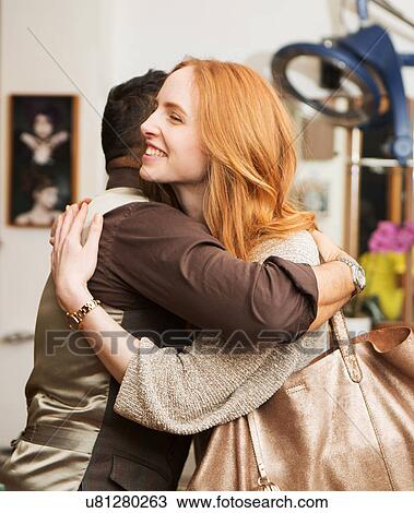 Male hairdresser hugging female customer in hair salon View Large Photo Image Stock Image - Male hairdresser hugging female customer in hair salon. Fotosearch