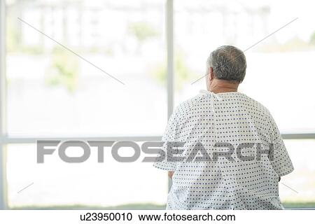 Male patient looking through window View Large Photo Image Stock Image - Male patient looking through window. Fotosearch