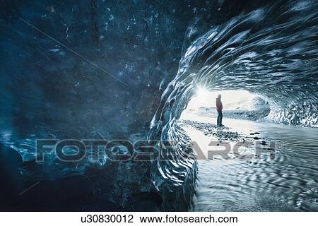 Male tourist in ice cave at Breidamerkurjokull, Iceland View Large Photo Image Stock Image - Male tourist in ice cave at Breidamerkurjokull, Iceland. Fotosearch