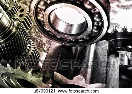 Stock Image - Metal cogs and ball bearings. Fotosearch