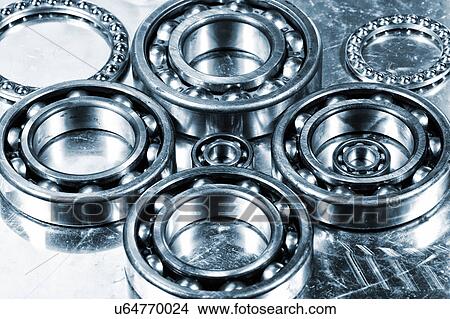 Metal cogs, ball bearings and gears View Large Photo Image Picture - Metal cogs, ball bearings and gears. Fotosearch