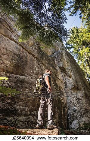 Mid adult man trekking through Murrin Provincial Park, Squamish, British Columbia, Canada View Large Photo Image Picture - Mid adult man trekking through Murrin Provincial Park, Squamish, British Columbia, Canada. Fotosearch