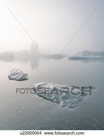 Picture - Misty view of ice bergs on glacial lagoon, Jokulsarlon, Iceland. Fotosearch