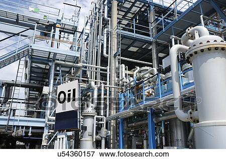 Oil refinery with pipework and sign View Large Photo Image Stock Photo - Oil refinery with pipework and sign. Fotosearch