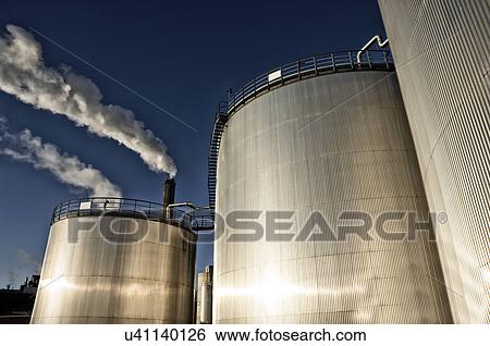 Oil storage towers View Large Photo Image Stock Photograph - Oil storage towers. Fotosearch