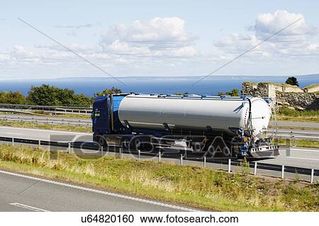 Stock Image - Oil tanker on highway. Fotosearch