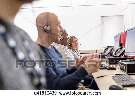 Stock Photo - Operators in automotive call centre in car factory. Fotosearch