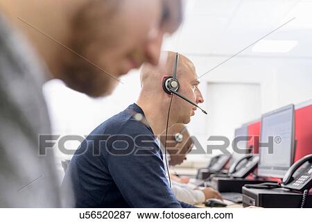 Operators in automotive call centre in car factory View Large Photo Image Stock Photo - Operators in automotive call centre in car factory. Fotosearch