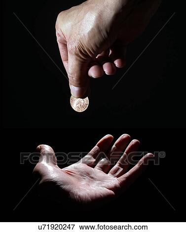 Person dropping coin on palm of hand View Large Photo Image Stock Photo - Person dropping coin on palm of hand. Fotosearch