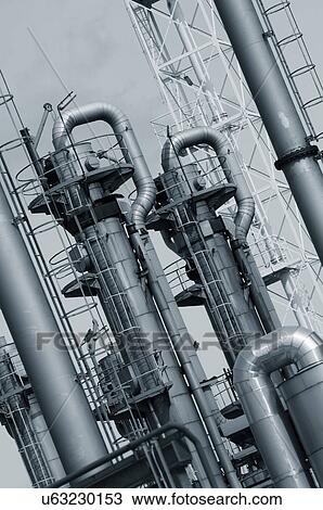 Pipes and chimneys on an oil and gas refinery View Large Photo Image Stock Image - Pipes and chimneys on an oil and gas refinery. Fotosearch