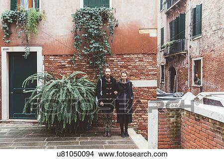 Picture - Portrait of couple in courtyard, Venice, Italy. Fotosearch