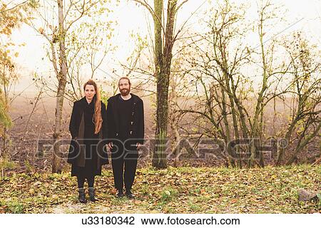 Stock Image - Portrait of couple in misty field. Fotosearch