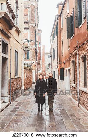 Stock Photo - Portrait of couple in street, Venice, Italy. Fotosearch