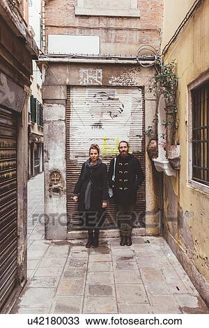 Stock Image - Portrait of couple on street, Venice, Italy. Fotosearch