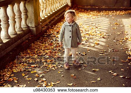 Stock Image - Portrait of cute girl looking away. Fotosearch