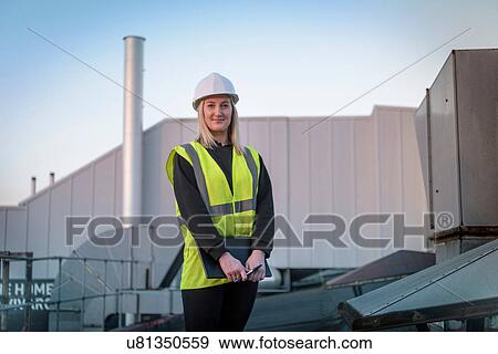 Portrait of ecologist in car plant View Large Photo Image Stock Photo - Portrait of ecologist in car plant. Fotosearch