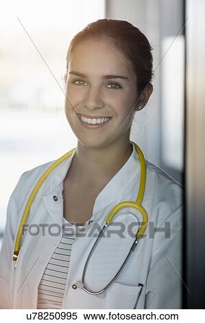 Portrait of female doctor, stethoscope around neck View Large Photo Image Stock Photography - Portrait of female doctor, stethoscope around neck. Fotosearch