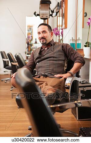 Portrait of mature male hairdresser in hair salon View Large Photo Image Stock Image - Portrait of mature male hairdresser in hair salon. Fotosearch