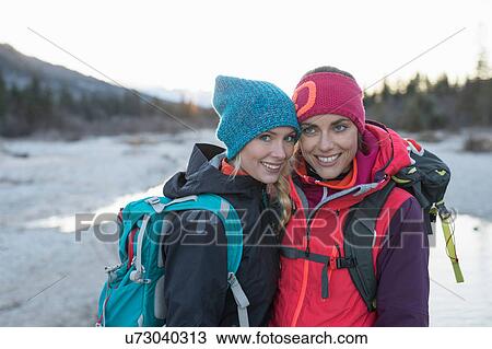 Portrait of two female hikers on lakeside in Bavarian Alps View Large Photo Image Stock Image - Portrait of two female hikers on lakeside in Bavarian Alps. Fotosearch