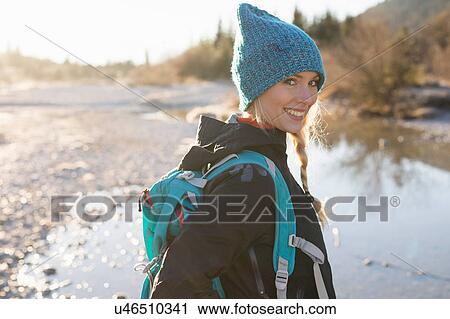 Portrait of young female hiker on lakeside in Bavarian Alps View Large Photo Image Stock Image - Portrait of young female hiker on lakeside in Bavarian Alps. Fotosearch
