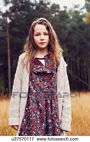 Stock Photo - Portrait of young girl in rural setting. Fotosearch