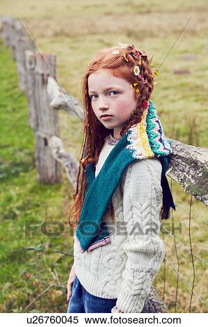 Stock Photography - Portrait of young girl in rural setting. Fotosearch