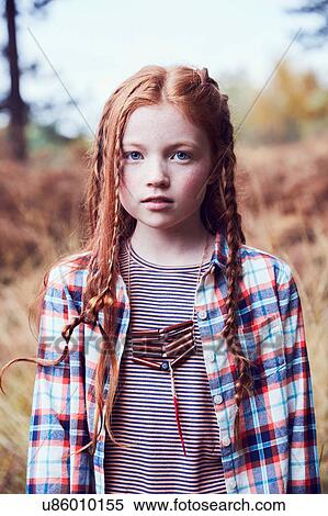 Stock Photography - Portrait of young girl in rural setting. Fotosearch