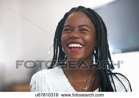 Portrait of young woman, smiling View Large Photo Image Stock Photo - Portrait of young woman, smiling. Fotosearch