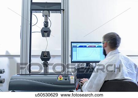 Scientist testing tensile strength of cable in laboratory View Large Photo Image Stock Photo - Scientist testing tensile strength of cable in laboratory. Fotosearch