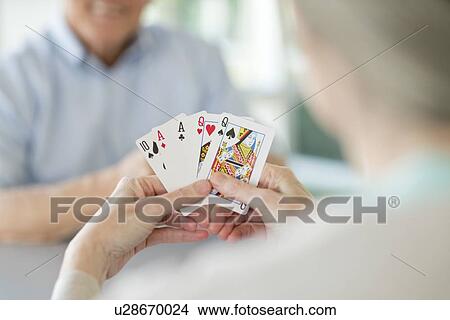 Picture - Senior couple playing cards. Fotosearch