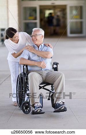 Senior man in wheelchair with care worker View Large Photo Image Stock Photograph - Senior man in wheelchair with care worker. Fotosearch