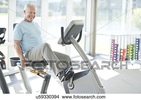 Senior man on static bike View Large Photo Image Picture - Senior man on static bike. Fotosearch