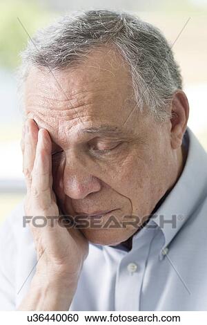 Senior man rubbing face View Large Photo Image Stock Image - Senior man rubbing face. Fotosearch