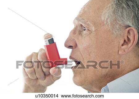 Senior man using inhaler View Large Photo Image Picture - Senior man using inhaler. Fotosearch