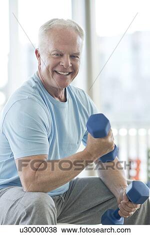 Senior man using weights View Large Photo Image Stock Photo - Senior man using weights. Fotosearch