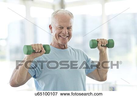Senior man using weights View Large Photo Image Stock Photo - Senior man using weights. Fotosearch