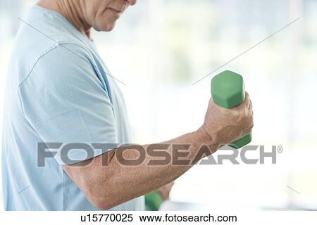 Senior man using weights View Large Photo Image Stock Photography - Senior man using weights. Fotosearch