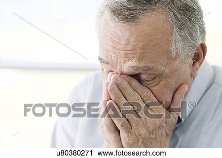 Senior man with hands covering face View Large Photo Image Stock Image - Senior man with hands covering face. Fotosearch