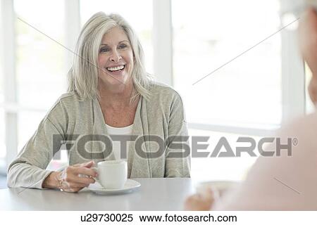 Stock Photography - Senior woman with cup of tea. Fotosearch